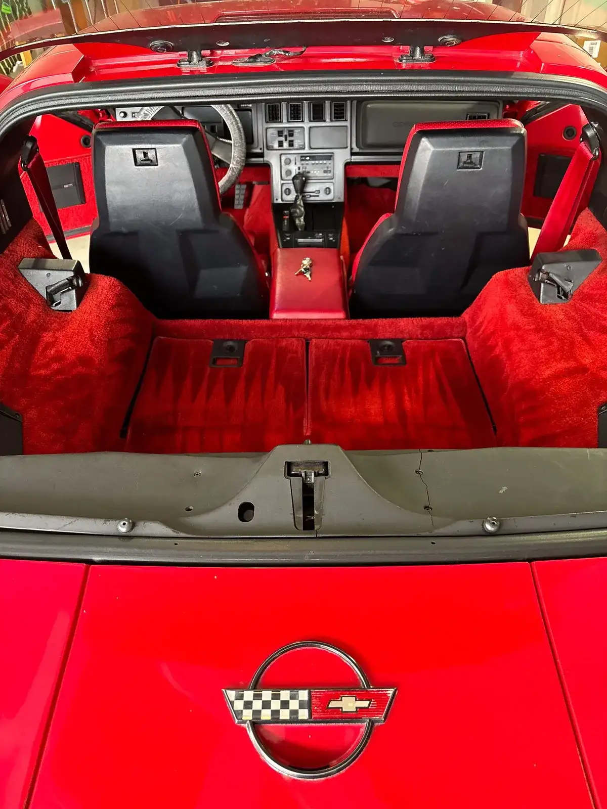 Bright red interior of a classic Chevrolet Corvette after a Premium Interior Detail